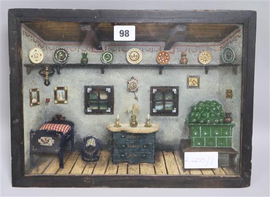 A shadow box of a cottage interior
